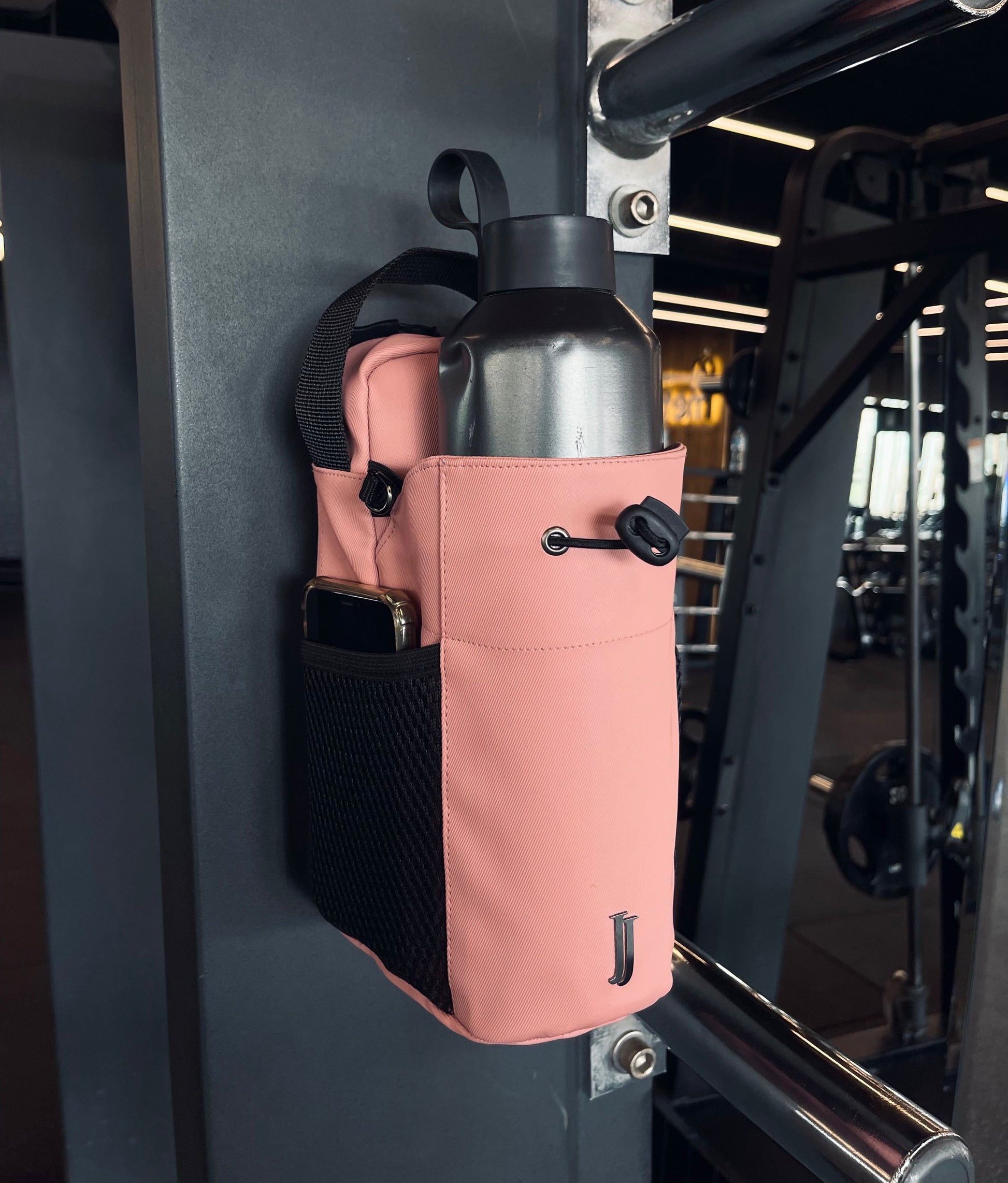 Cotton Candy pink magnetic gym bag with bottle holder in gym